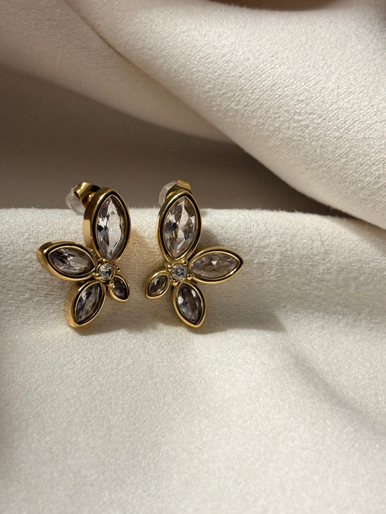 Zircon petal earrings in 18kt gold.