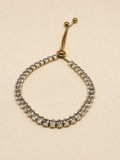 Adjustable tennis bracelet with AAA cubic zirconia stones in 18KT PVD gold-plated stainless steel by NIYANSA.