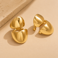 NIYANSA non piercing gold ear cuffs with a bold sculptural silhouette and polished 18KT PVD gold finish.