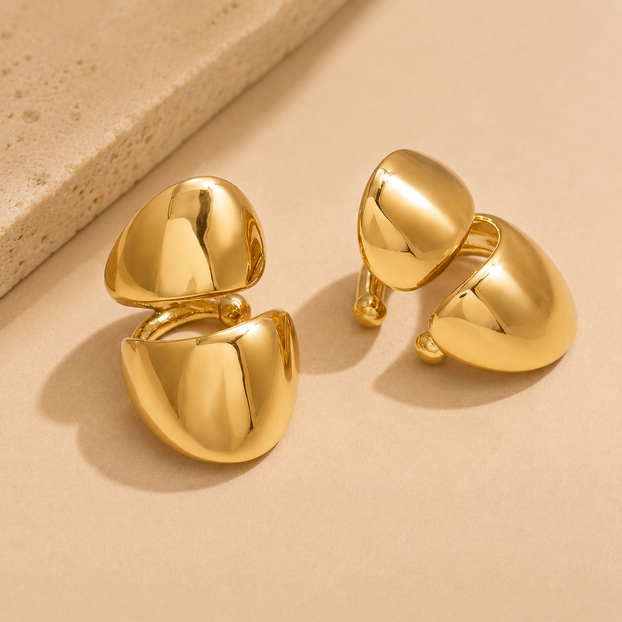 NIYANSA non piercing gold ear cuffs with a bold sculptural silhouette and polished 18KT PVD gold finish.