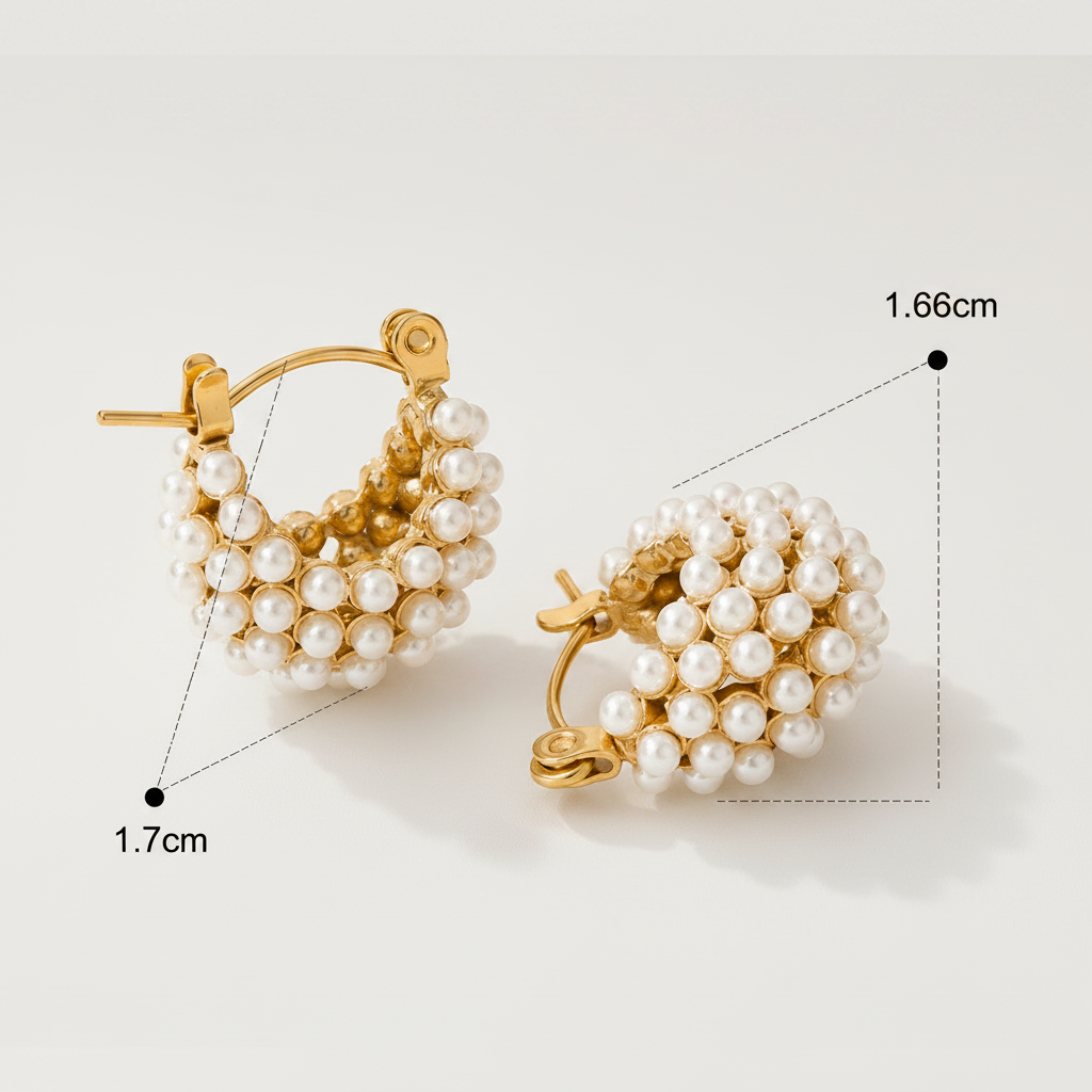 Gold plated huggies with pearl accents by NIYANSA