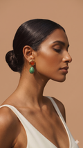 Woman wearing colorful earrings against a beige background