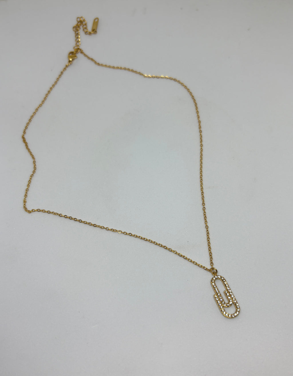 Gold necklace with interlocking AAA cubic zirconia link pendant in 18KT PVD gold-plated stainless steel by NIYANSA.