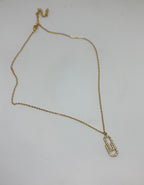 Gold necklace with interlocking AAA cubic zirconia link pendant in 18KT PVD gold-plated stainless steel by NIYANSA.