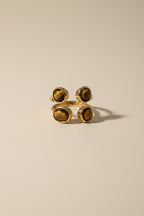 The Noor Cluster Stone Adjustable Ring made using 18kt gold pvd plated on 316L grade titanium steel.