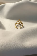 Aurelia Abstract Ring is made with 18kt gold PVD plated on 316L grade titanium steel. 