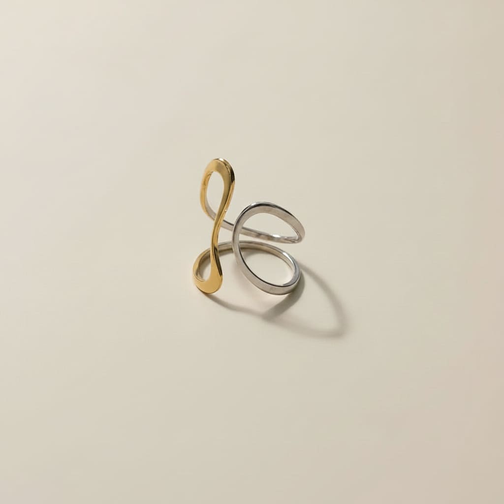 Ananta Dual Tone Infinity Ring is designed with 18kt gold pvd plated on 316L grade titanium steel.