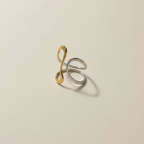 Ananta Dual Tone Infinity Ring is designed with 18kt gold pvd plated on 316L grade titanium steel.