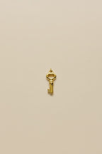 Our Key Charm crafted in 18kt gold plated on 316L grade titanium steel.