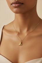 18kt Gold rocket ship on a thin gold chain coated on 316L grade stainless steel