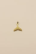 Whale Fin Charm, crafted in 18kt gold plated on 316L grade titanium steel.
