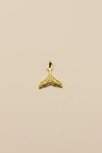 Whale Fin Charm, crafted in 18kt gold plated on 316L grade titanium steel.