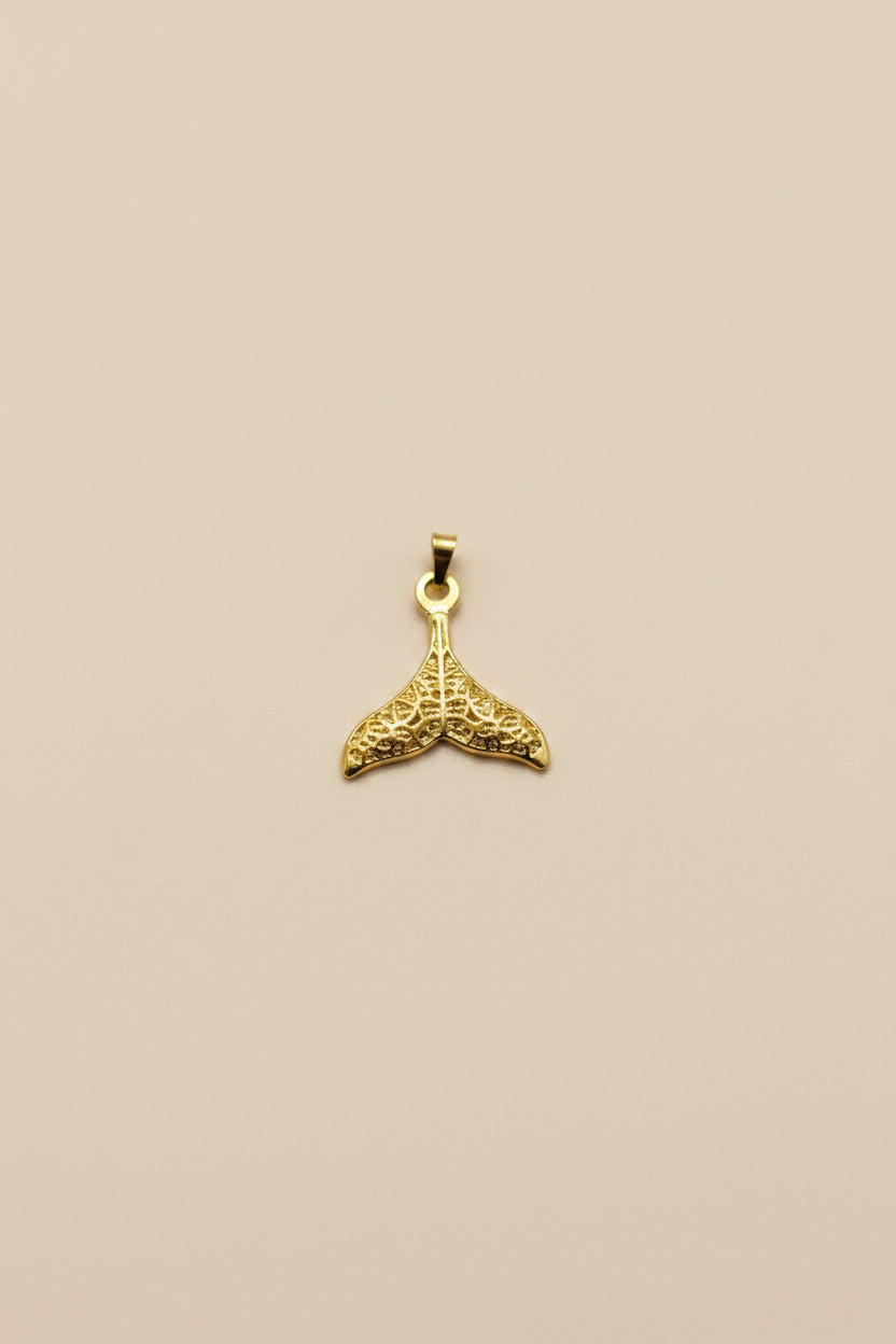 Whale Fin Charm, crafted in 18kt gold plated on 316L grade titanium steel.