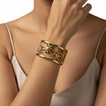 18 kt gold-plated cuff on 316l grade stainless steel.