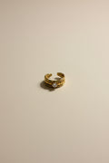 Adjustable gold ring with AAA cubic zirconia in 18KT PVD gold plated stainless steel.