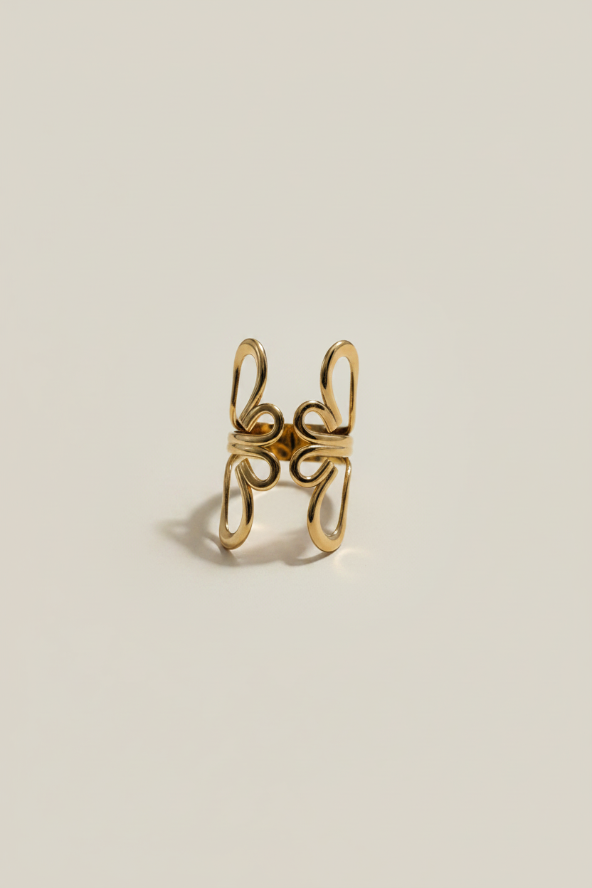 NIYANSA flower-inspired adjustable gold ring with sculptural open petals and 18KT PVD gold plating.