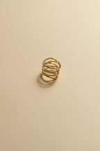 Minimalist gold ring with woven multi-band design in 18KT PVD gold plated stainless steel.
